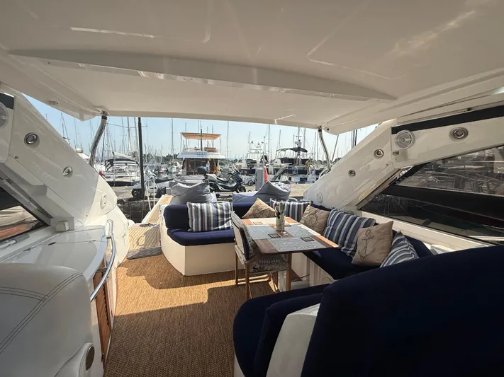  Yacht Photos Pics Luxurious 2006 Sunseeker Portofino 53 yacht interior with elegant seating and marina view.