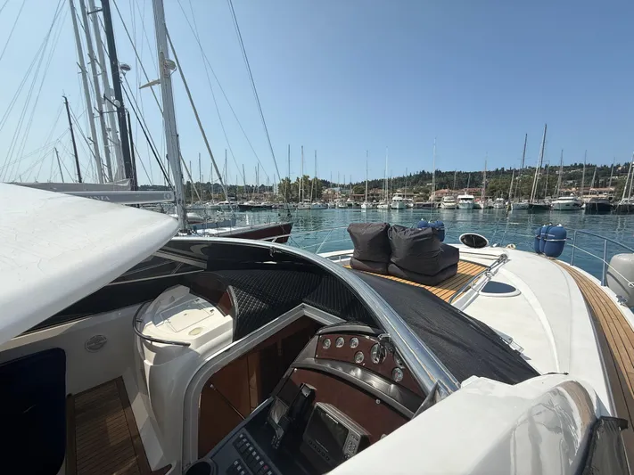  Yacht Photos Pics 2006 Sunseeker Portofino 53 yacht docked in a marina, showcasing sleek design and luxury features.