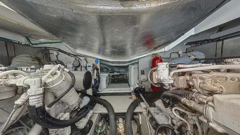  Yacht Photos Pics Engine room of a 2006 Sunseeker Portofino 53 yacht, showcasing mechanical components.