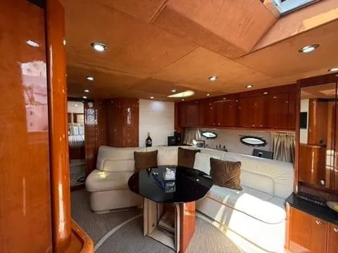  Yacht Photos Pics Luxurious interior of 2006 Sunseeker Portofino 53 yacht with elegant seating and wood finishes.