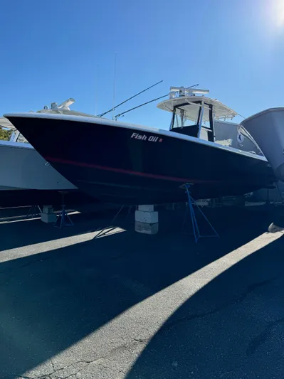  Yacht Photos Pics 2013 Contender 35 ST boat on stands under clear blue sky.