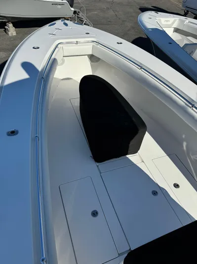  Yacht Photos Pics 2013 Contender 35 ST boat, white deck, spacious seating area, sleek design.