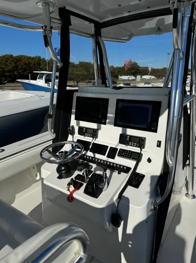  Yacht Photos Pics 2013 Contender 35 ST boat cockpit with dual screens and steering wheel.