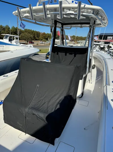  Yacht Photos Pics 2013 Contender 35 ST boat with covered console and seating area.