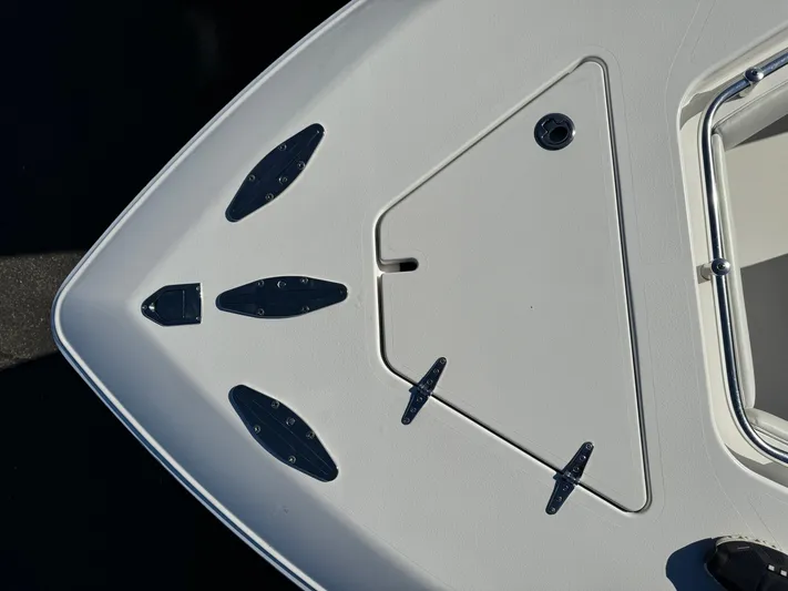  Yacht Photos Pics Bow of 2013 Contender 35 ST boat with anchor hatch and cleats.