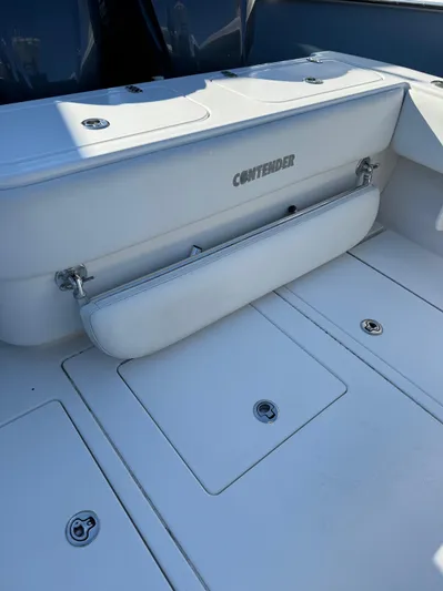  Yacht Photos Pics 2013 Contender 35 ST boat interior with white seating and storage compartments.