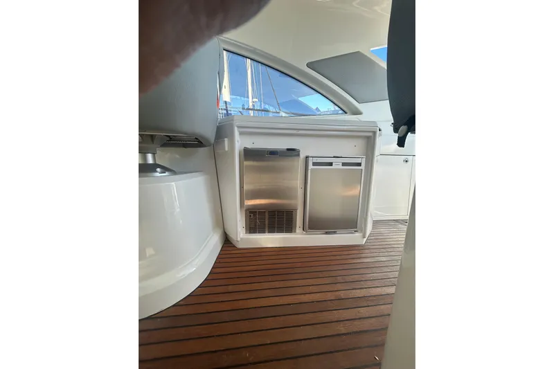  Yacht Photos Pics Interior of 2012 Beneteau Gran Turismo 44 yacht with wooden flooring and built-in appliances.