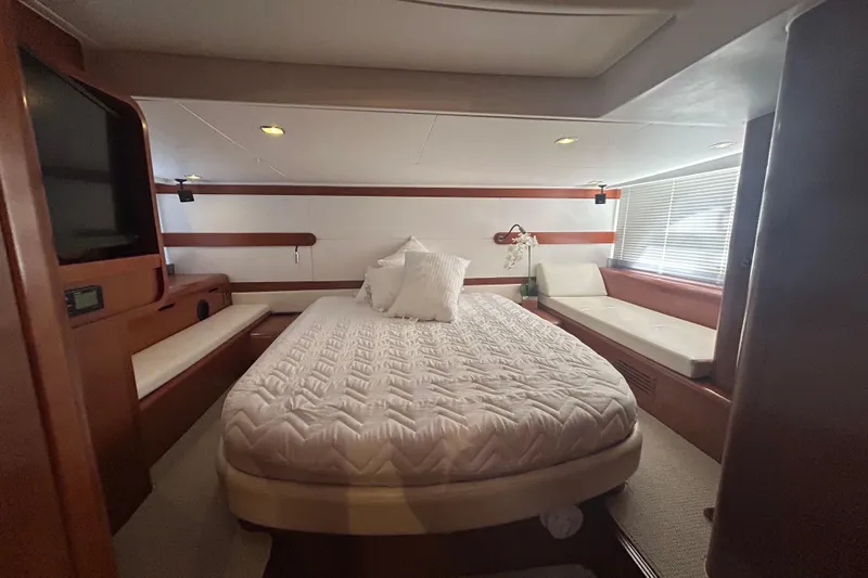  Yacht Photos Pics Luxurious cabin interior of 2012 Beneteau Gran Turismo 44 yacht with cozy bed and seating.
