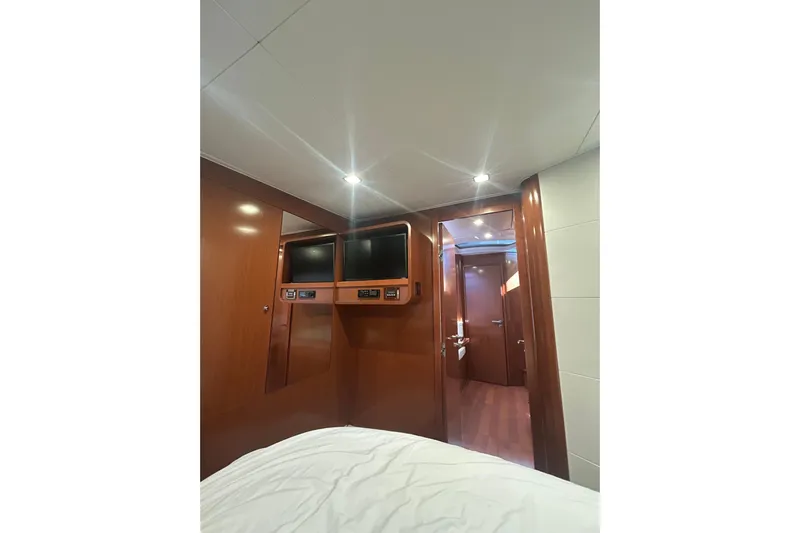  Yacht Photos Pics Interior cabin of 2012 Beneteau Gran Turismo 44 yacht with wood paneling and modern amenities.