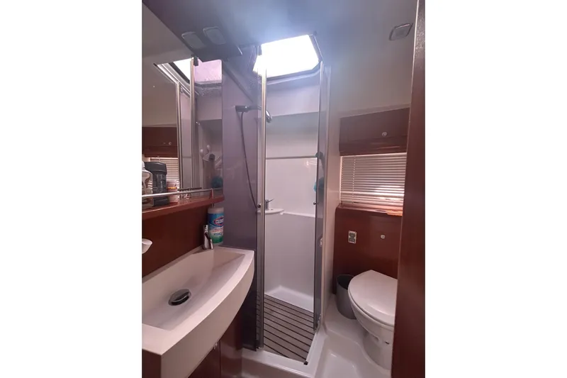  Yacht Photos Pics Bathroom interior of 2012 Beneteau Gran Turismo 44 yacht, featuring sink, shower, and toilet.