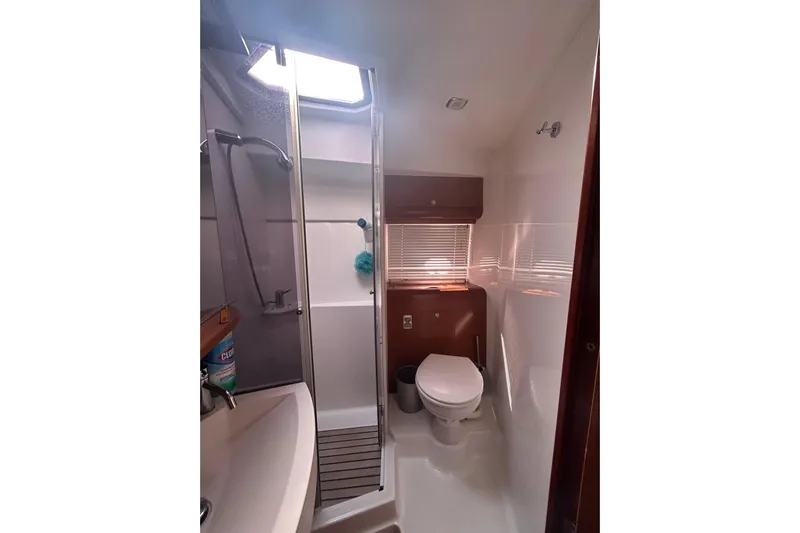  Yacht Photos Pics Bathroom interior of 2012 Beneteau Gran Turismo 44 yacht, featuring shower and toilet.
