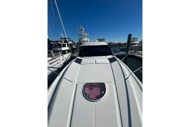  Yacht Photos Pics 2012 Beneteau Gran Turismo 44 yacht docked at marina under clear blue sky.