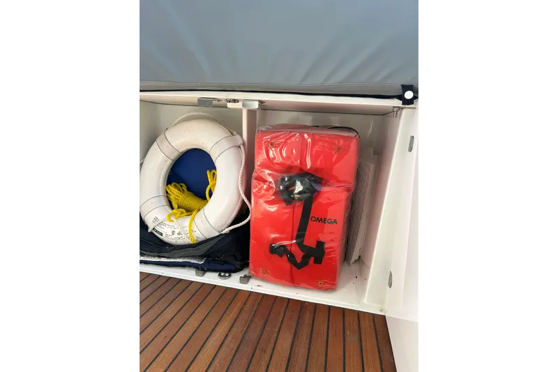  Yacht Photos Pics Storage compartment on 2012 Beneteau Gran Turismo 44 with life ring and safety equipment.