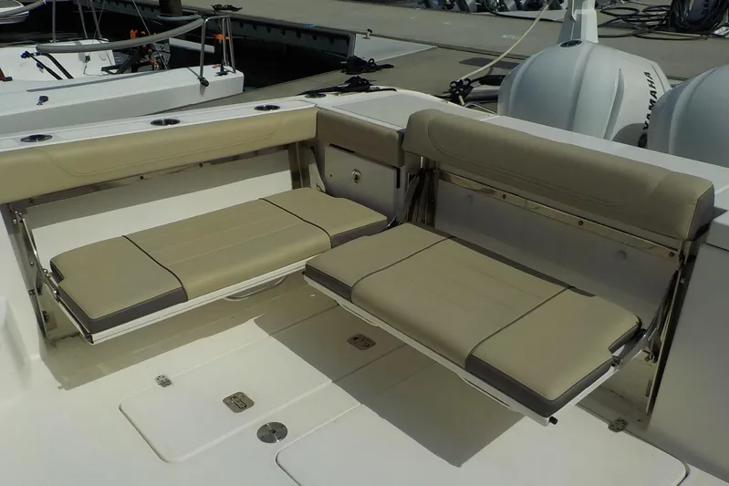  Yacht Photos Pics 2020 Pursuit OS 355 Offshore boat with beige foldable seating in the cockpit area.