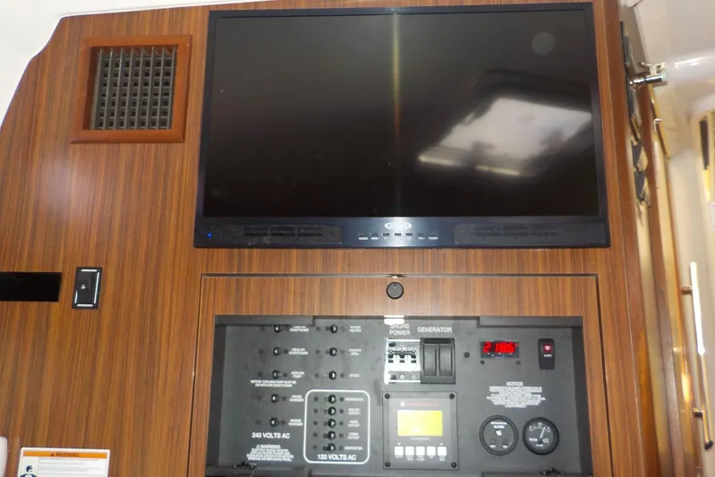  Yacht Photos Pics Control panel and screen inside 2020 Pursuit OS 355 Offshore boat cabin.