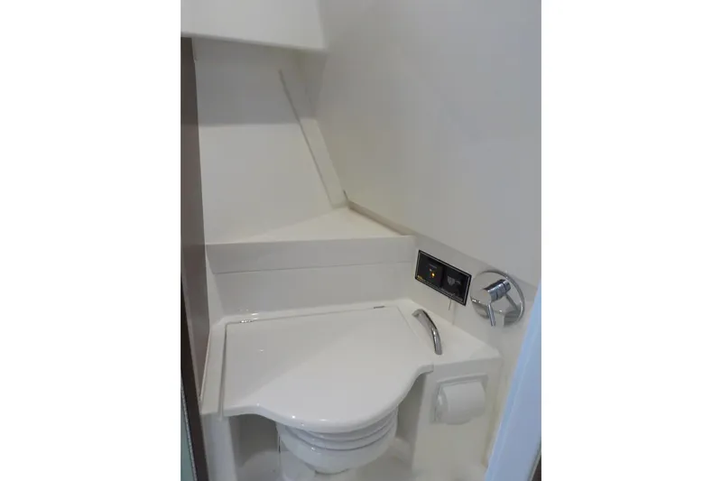  Yacht Photos Pics 2020 Pursuit OS 355 Offshore boat bathroom with modern toilet and control panel.