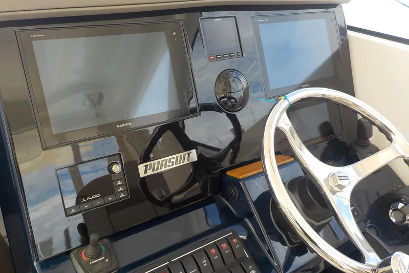  Yacht Photos Pics 2020 Pursuit OS 355 Offshore helm with Garmin displays and JL Audio system.