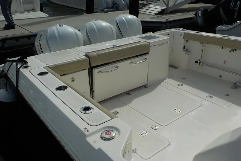  Yacht Photos Pics 2020 Pursuit OS 355 Offshore boat deck with seating and storage compartments.