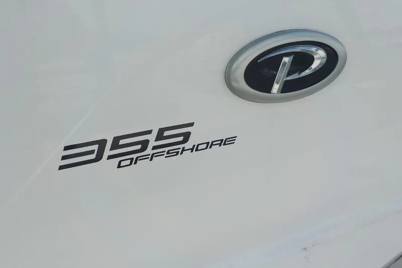  Yacht Photos Pics 2020 Pursuit OS 355 Offshore boat logo and emblem on white surface.