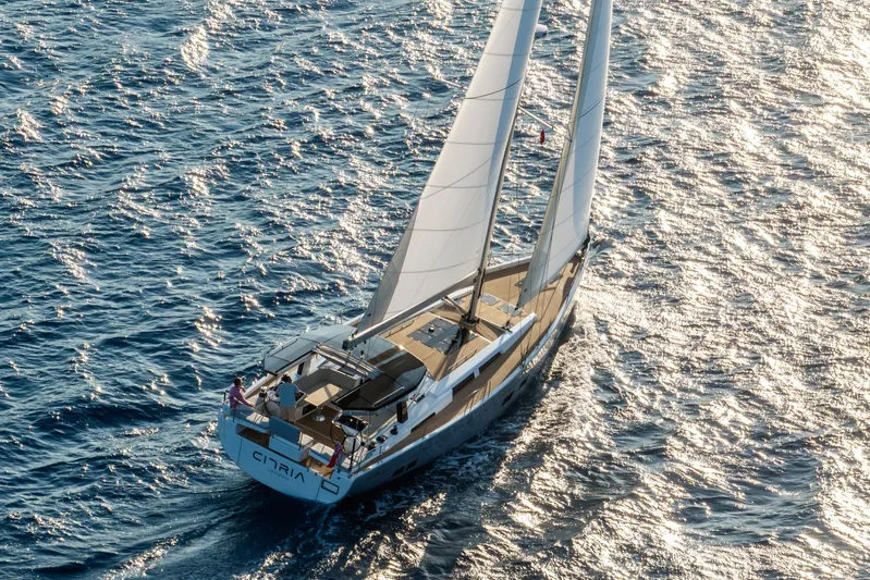 Hanse 588 Yacht Photos Pics 2024 Hanse 588 sailing yacht gliding on sunlit ocean waters.