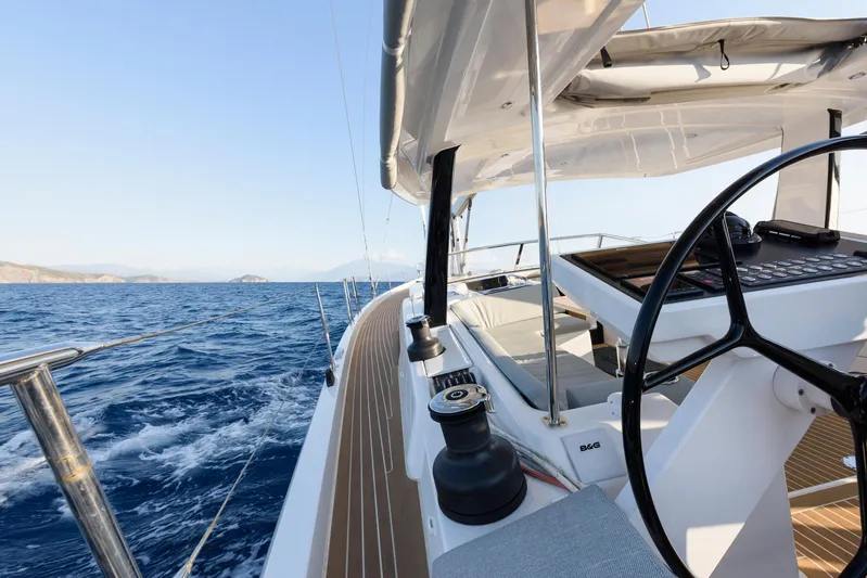 Hanse 588 Yacht Photos Pics 2024 Hanse 588 yacht sailing on open sea with clear blue skies.