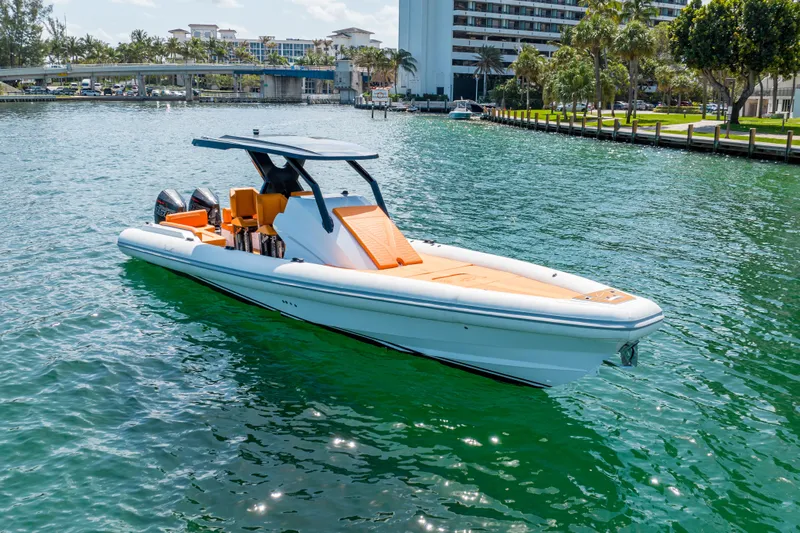 Novielli Yacht Photos Pics 2026 Novielli Veloche 349 boat on clear water, modern design, vibrant orange seating.