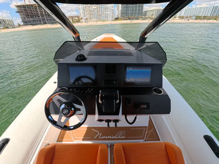 Novielli Yacht Photos Pics Cockpit view of 2026 Novielli Veloche 349 boat with modern dashboard and steering wheel.