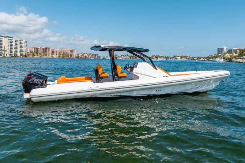 Novielli Yacht Photos Pics 2026 Novielli Veloche 349 boat on water, featuring sleek design and vibrant orange seating.