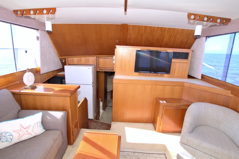 Fishin Post Yacht Photos Pics Interior of 1990 Post 44 Sport Fisherman yacht with cozy seating and ocean view.