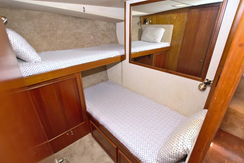 Fishin Post Yacht Photos Pics 1990 Post 44 Sport Fisherman cabin with bunk beds and wooden interior.