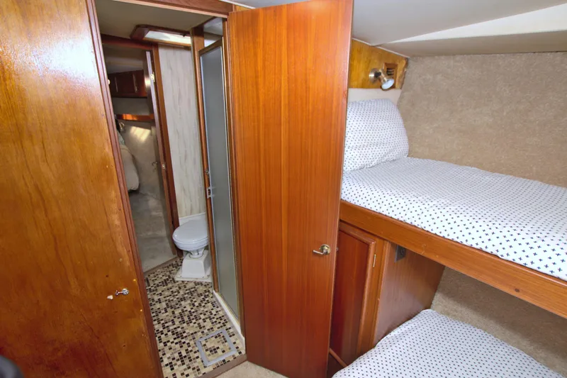Fishin Post Yacht Photos Pics Interior of 1990 Post 44 Sport Fisherman with bunk beds and bathroom.