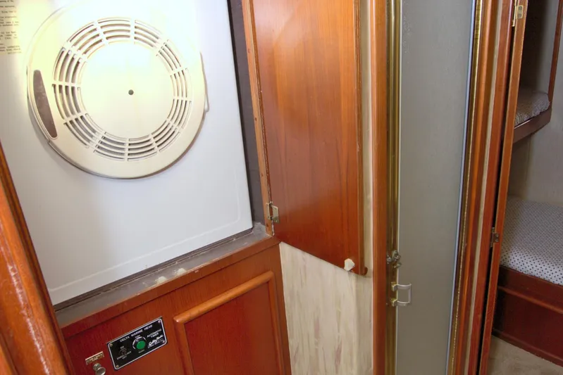 Fishin Post Yacht Photos Pics 1990 Post 44 Sport Fisherman interior with dryer and wooden cabinetry.