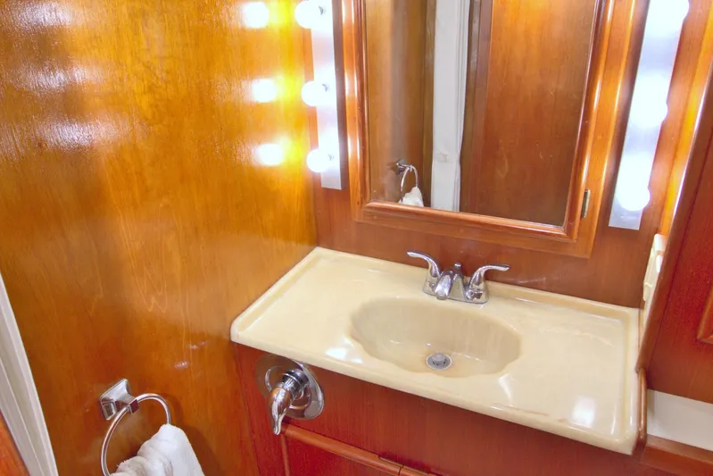 Fishin Post Yacht Photos Pics Bathroom vanity with mirror and lights on 1990 Post 44 Sport Fisherman yacht.