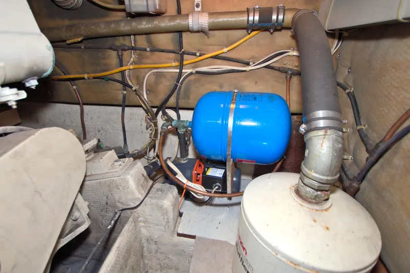 Fishin Post Yacht Photos Pics Engine room of 1990 Post 44 Sport Fisherman with blue tank and pipes.