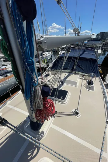  Yacht Photos Pics 2002 Island Packet 380 sailboat deck with ropes and mast in marina.