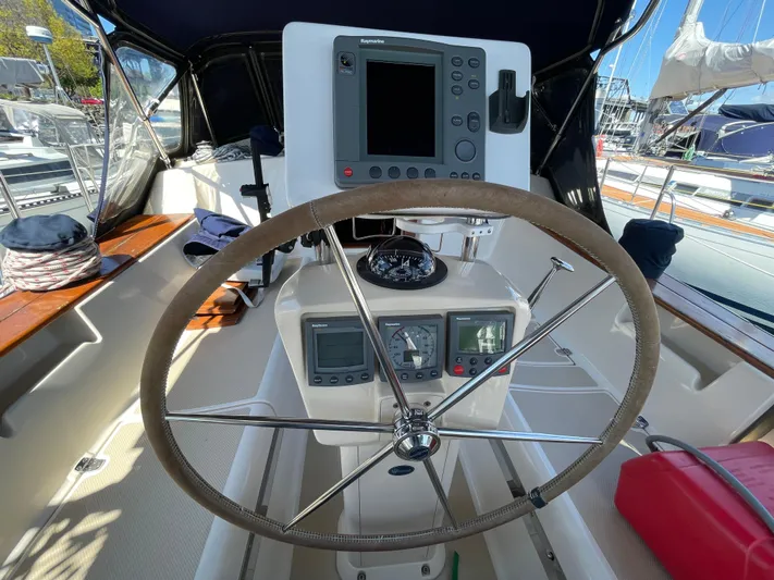  Yacht Photos Pics Steering wheel and navigation equipment on a 2002 Island Packet 380 sailboat.