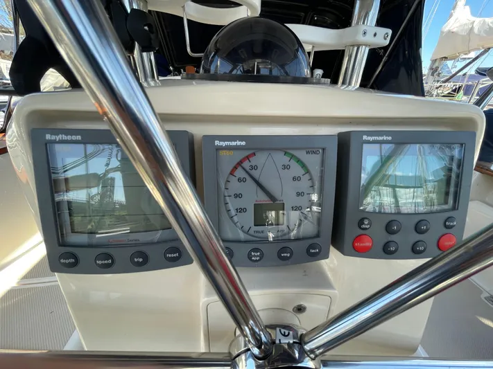  Yacht Photos Pics Cockpit instruments on a 2002 Island Packet 380 sailboat, featuring Raymarine displays.