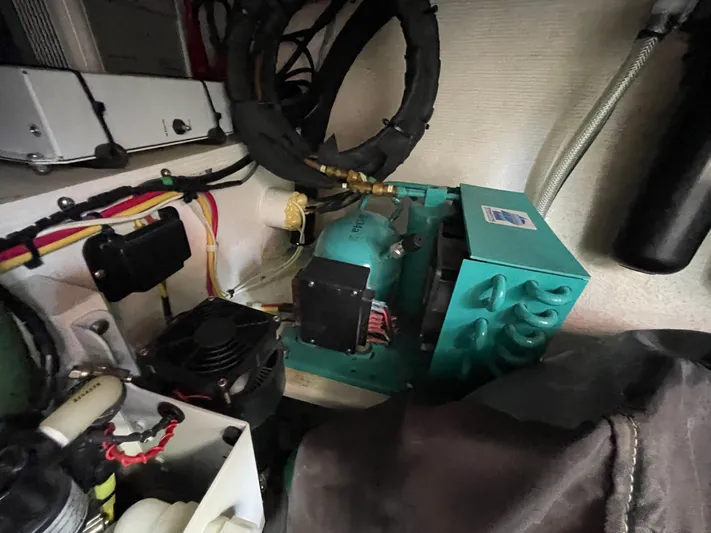  Yacht Photos Pics Engine compartment of a 2002 Island Packet 380 sailboat, showcasing mechanical components.