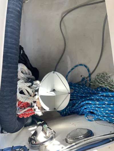  Yacht Photos Pics Storage compartment on a 2002 Island Packet 380 sailboat with ropes and equipment.