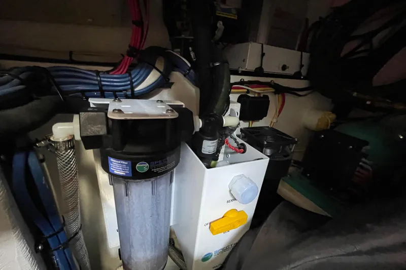  Yacht Photos Pics Engine compartment of a 2002 Island Packet 380 sailboat, showcasing mechanical components and wiring.