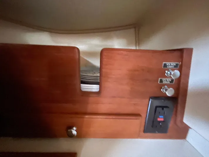  Yacht Photos Pics Wooden cabinet with switches and outlet on a 2002 Island Packet 380 yacht.