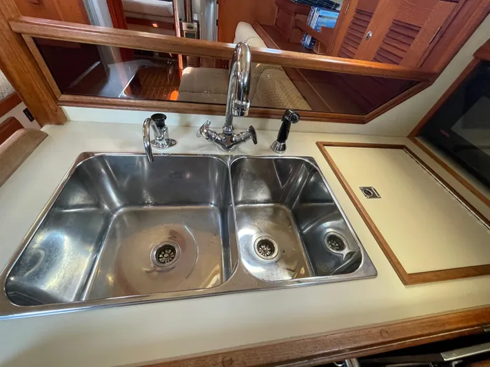  Yacht Photos Pics Double stainless steel sink in 2002 Island Packet 380 yacht kitchen.
