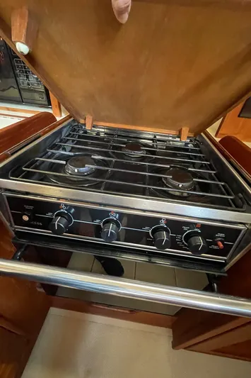 Yacht Photos Pics Stove in 2002 Island Packet 380 yacht kitchen with wooden cover open.