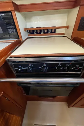  Yacht Photos Pics Island Packet 380 (2002) yacht kitchen with stove and microwave.