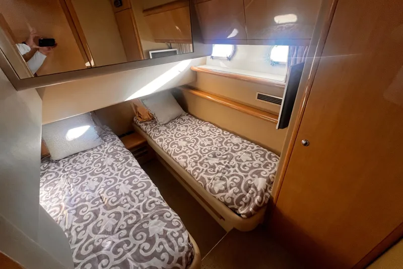 Resilient Sea Yacht Photos Pics 2004 Ferretti Yachts 530 cabin with twin beds, elegant wood finish, and natural light.