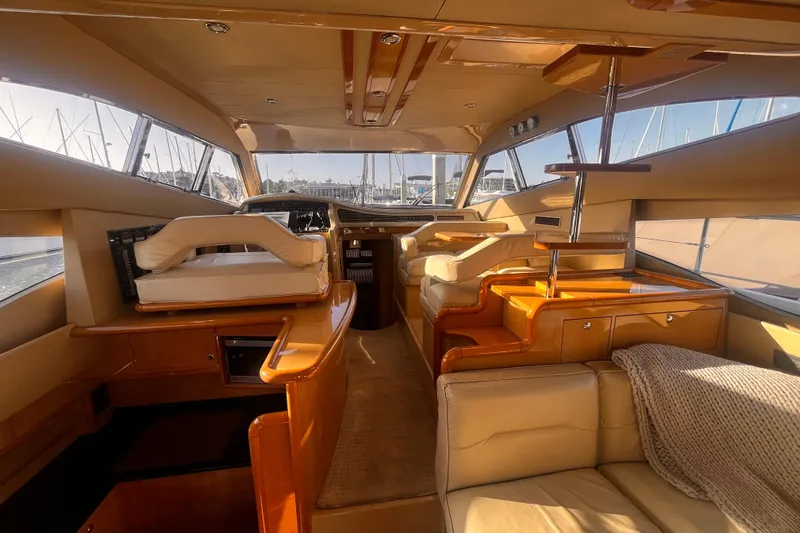 Resilient Sea Yacht Photos Pics Luxurious interior of a 2004 Ferretti Yachts 530, featuring elegant wood and leather finishes.