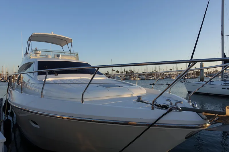 Resilient Sea Yacht Photos Pics 2004 Ferretti Yachts 530 docked in a marina at sunset.