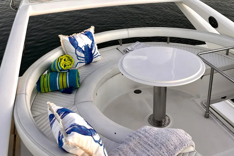 Resilient Sea Yacht Photos Pics Luxurious seating area on a 2004 Ferretti Yachts 530 with cushions and towels.