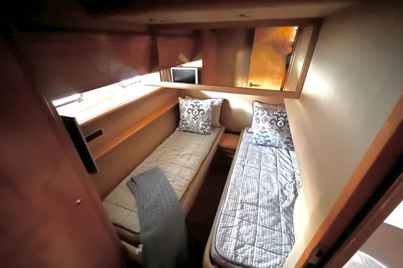 Resilient Sea Yacht Photos Pics 2004 Ferretti Yachts 530 cabin with twin beds and decorative pillows.