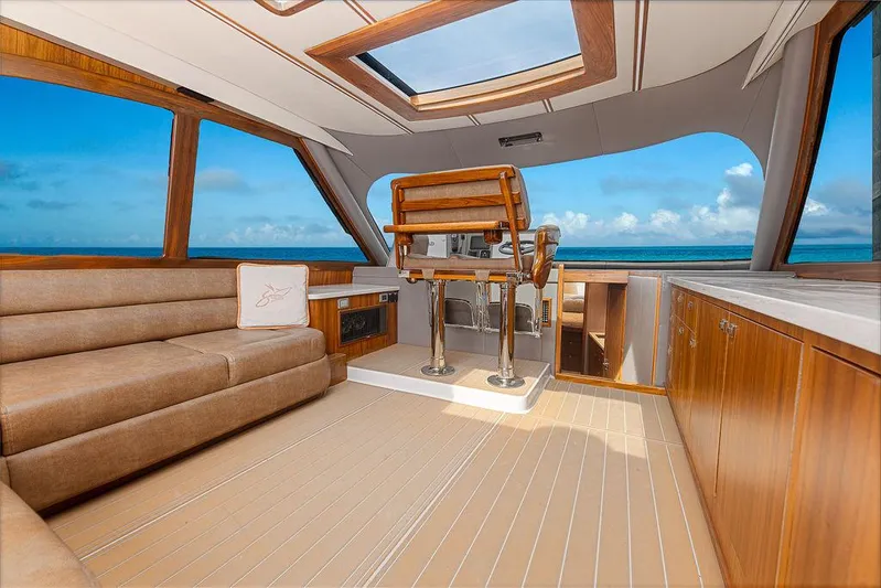 Jet Stream Yacht Photos Pics Luxurious interior of 2018 Spencer Yachts Jet Boat with ocean view and elegant wood finishes.